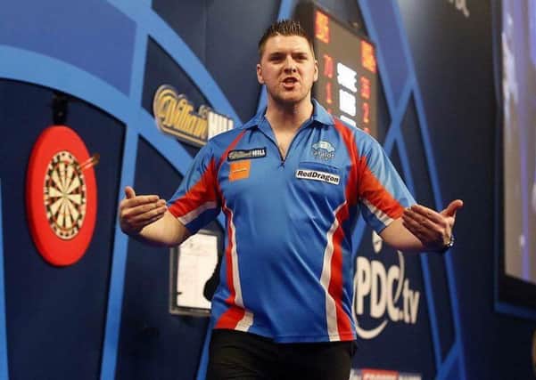 Daryl Gurney celebrates after his win over Jamie Lewis in the first round of the William Hill World Darts Championships.