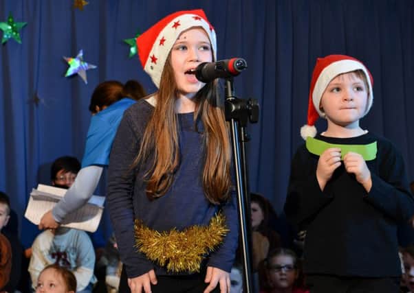 In full voice during the Phoenix Integrated Primary School Christmas concert.INMM5215-345