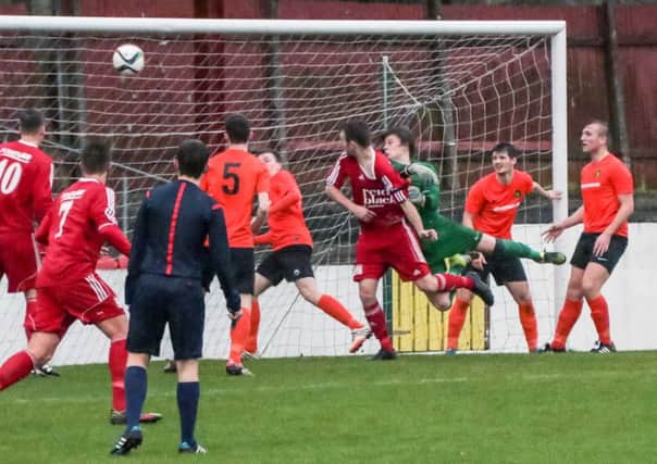 Michael McQuitty scores the second goal for Ballyclare against Carrick Rangers Reserves at Dixon Park INNT 51-542-SO