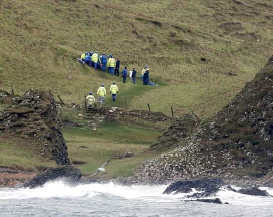 20 December 2015..A man has been rescued after falling on the Causeway Coast Way part of the Ulster Way near Ballintoy Harbour on Sunday afternoon. The walk is an exhilarating 33-mile route along the most celebrated stretch of coastline in Northern Ireland.Rescue teams from Ballycastle and Coleraine coastguard were scrambled just after lunchtime to a victim of the terrain. It is understood that one male had fallen after the heavy rain had made conditions difficult on the walk. The Northern Ireland Ambulance Service dispatched paramedics to the scene as well and they removed the casualty to Causeway Hospital in Coleraine where he is being assessed and it is believed he has a broken ankle. PICTURE KEVIN MCAULEY/MCAULEY MULTIMEDIA