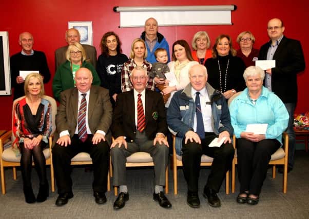 Pictured are some charity and local group members who were awarded money from the Derry Midweek League.