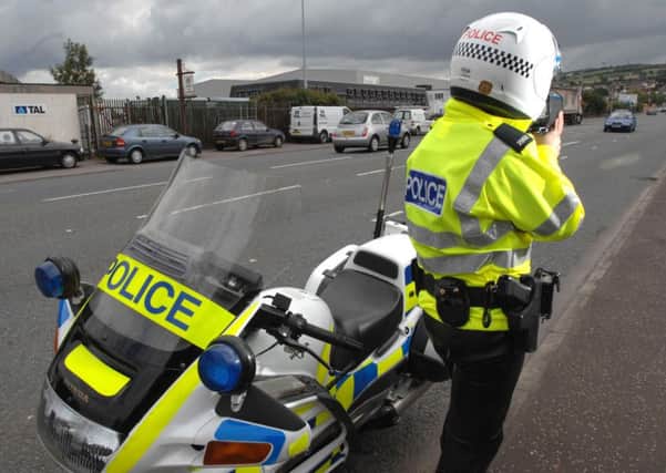 PSNI Road traffic officer with a speed gun. PACEMAKER
