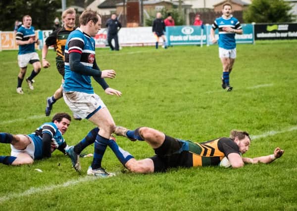 David Gilkinson crossing for a Lisburn try. Pic by Gary Barlow