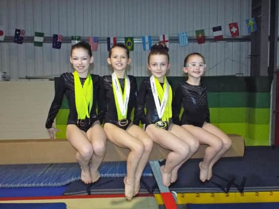 Four Level 3 gymnasts from SIKA who won medals.