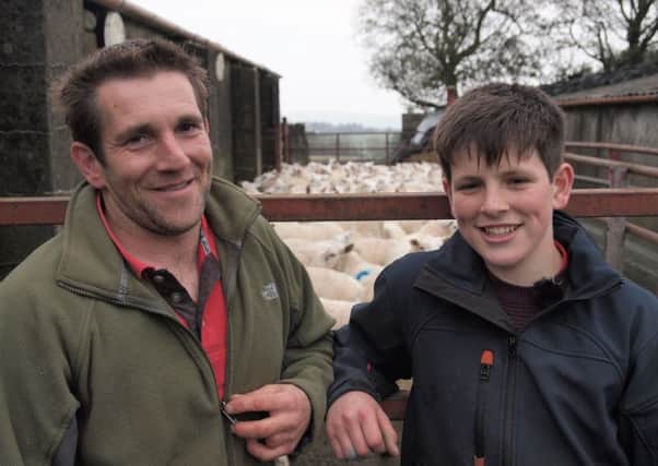Ballycarry farmer Ricky Cowan and his 13-year-old son Matthew, who assists his father in lambing the farms ewes.  INCT 01-725-CON