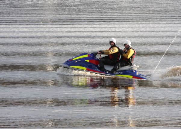 Members of the Foyle Search and Rescue team on one of the jet skis. 1703JM30