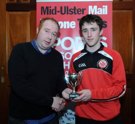 James Devlin who was a monthy winner in the Mid-Ulster Mail & Tyrone Times Sport Personality of the Year competition receives his award from Patrick Cullen.INTT1015-417