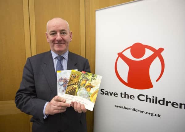 Mark Durkan, SDLP, poses for a photo in support of unaccompanied child refugees
Portcullis House, Westminster, London. 15.12.2015.

Save the Children hold a parliamentary event to highlight the plight of unaccompanied child refugees who have recently arrived in Europe and encourage the British government to give 3,000 of these children a home.
 
Save the Children have teamed up with education provider, Pearson, to child refugees a special pack of books â appropriate to their age and ability â to help them learn English and help them to access education and rebuild their lives here. Members of Parliament and the House of Lords from across the political spectrum attended to write messages of encouragement and welcome for unaccompanied child refugees.