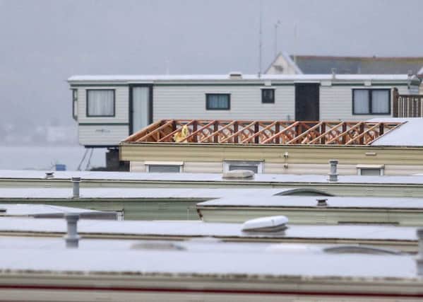 A roof has been ripped off a caravan in the chaos of storm Frank. Pic Steven McAuley/McAuley Multimedia