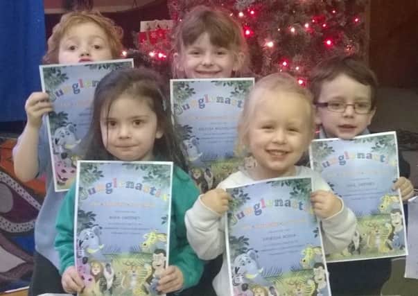 Pupils from Glengormley Integrated Primary School receive their Junglenastix certificates. Aodhan Mulcahy, Melissa Mulholland, Saul Sweeney, Maya Sweeney and Vanessa Rocha. INNT 02-804CON