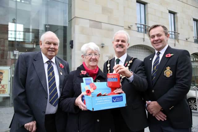 Pictured with the Mayor of Lisburn & Castlereagh City Council, Councillor Thomas Beckett as he buys the first poppy are: (l-r) Ivan McCammon, Poppy Organiser, Royal British Legion (Lisburn Branch); Anne Hood, President of the RBL Women's Section; Raymond Corbett, President, Royal British Legion (Lisburn Branch).