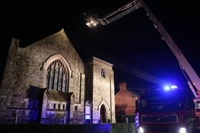 11th January 2016....McAuley Multimedia...The Northern Ireland Fire and Rescue Service were called to St Colemans Parish Church at 0109 Hrs on Monday morning to reports of the church on fire. A number of fire appliances attended with a Aerial Appliance a specialist Command unit andÂ  FESS unit. The blaze was quickly brought under control. One firefighter sustained injury while fighting the blaze. At this stage it is not known what caused the fire that broke out just after 1am. The people of the hamlet of Dunmurry first worshipped in a building known as the Assembly Rooms, constructed in 1874 and in use today as the parochial hall.The consecration, by The Rt Rev John Baptist Crozier, Lord Bishop of Down, Connor and Dromore, took place on St. Mark's Day, 25th April 1908. The Parish continued to be linked to Drumbeg Parish until 1932.Canon Ellis was appointed curate-in-charge and was made Rector in 1945. After his retirement he was followed in turn by Canon Terry Rodger, the Rev Mike McCann, the late Rev Tom Prie