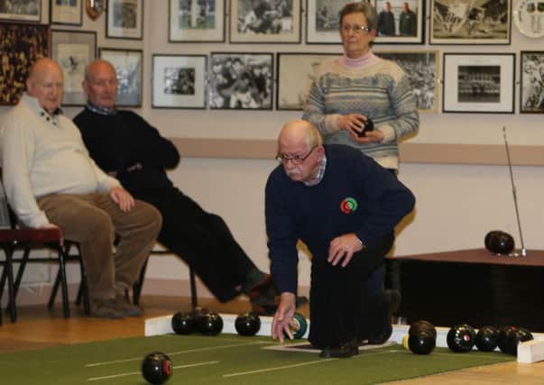 David Cooke of Maine Bowling Club delivers a bowl during last week's league game at Eaon Park. INBT 02-172CS