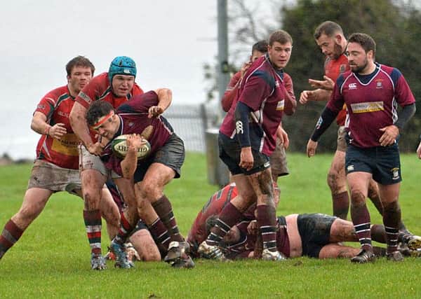 Ryan McAlister gets his man for Larne RFC in their game with Enniskillen RFC. INLT 02-008-PSB