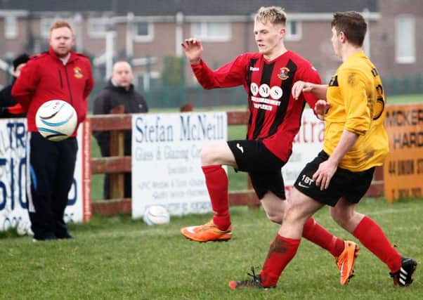 Seagoe's Kyle Murray skips past the challenge of a Lurgan Town player.INPT02-680AM