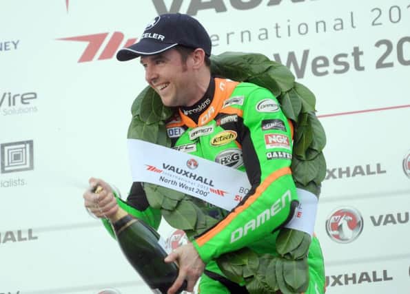 Alastair Seeley celebrates winning  the Supersport race in 2013.
PICTURE BY STEPHEN DAVISON