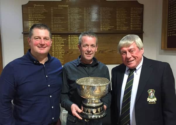 At the presentation of the Montgomery Rosebowl to Ian Lamb (centre) are, from left, Ian Richardson (Richardson's Meats) and John McCallum (club captain).