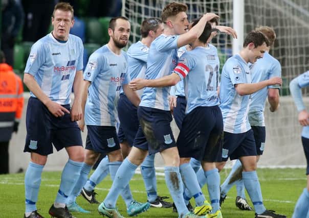 Ballymena players celebrate after taking the lead against Linfield before going on to win 3-2
