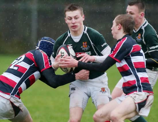 Schools Rugby - Friend's David Newell pushes forward against Wellington's Jamie Hewitt (right).    Picture by Jonathan Porter/PressEye