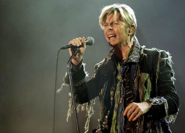 13/06/04 PA File Photo of David Bowie performing live onstage during the Isle of Wight festival at Seaclose Park in Newport, Isle of Wight. See PA Feature MUSIC Bowie. Picture credit should read: Yui Mok/PA Photos. WARNING: This picture must only be used to accompany PA Feature MUSIC Bowie