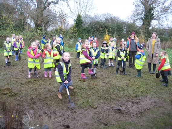 Central Primary School pupils planting trees. INCT 02-755-CON