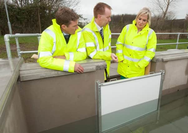 Michelle O'Neill (Minister of Agriculture and Rural Development) along with Jonathan McKee  (Director of Developement Rivers Agency) and David Porter (Chief Executive Rivers Agency) viewed the flood protection test facility at Craigavon.