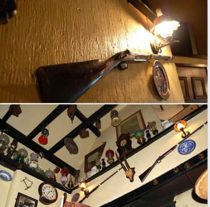 Images of the gun (top) and in situ (below) which went missing from The Crosskeys Inn over Christmas.The owners are appealing for its return. (Submitted Picture).