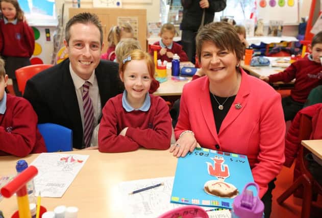 Press Eye - Belfast - Northern Ireland - 12th January 2016 - 

New First Minister Arlene Foster visits Pond Park Primary School in Lisburn on her first engagement. 
She is pictured with meeting pupils from Primary 3 with Paul Givan MLA during the tour of the school.

Picture by Kelvin Boyes / Press Eye.