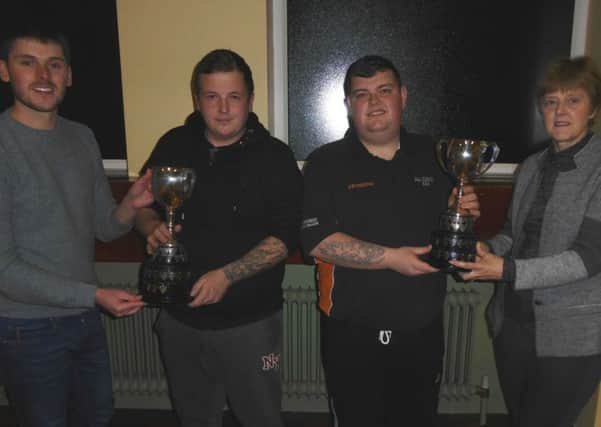Chris Snoddy and Elizabeth Woods presenting Nigel Todd and Darren Witherspoon of All Saints with their Churches' Pairs trophies. INLT 02-950-CON