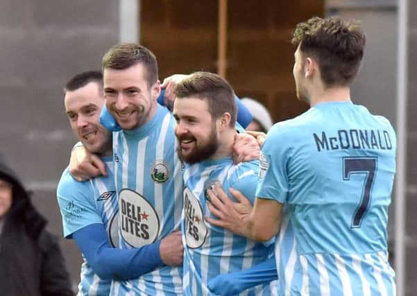 Warrenpoint's Stephen Murray 
celebrates after scoring during the win over Coleraine