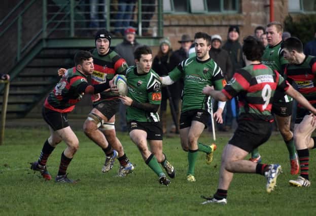 Simon Logue powers through to score a try for City of Derry during Saturday's match against Highfield. INLS0316-153KM