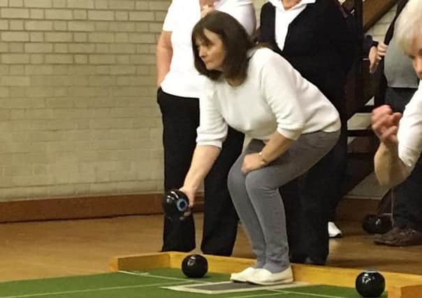 Eva Gage delivers a bowls for Mid-Antrim in Saturday's Plate win over Mid-Ulster in Maghera.