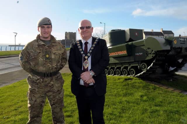 The historical Churchill tank is the backdrop as Mid and East Antrim Mayor, Councillor Billy Ashe, announces the Freedom of the Borough is to be conferred on B (North Irish Horse) Squadron, Scottish & North Irish Yeomanry, included is Lt. Joshua Campbell. INCT 03-201-AM