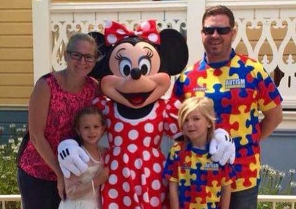Kris and Kerri-Ann James with their children Kaden and Ana-Lucia during a trip to Disneyland.  INCT 03-721-CON