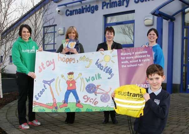 Carnalridge Primary School pupil Oran Carruthers (age 8) who won first prize in the Sustrans poster competition. Included are, Emma Keenan, Sustrans, Lynn White, teacher, Liz Harris, acting principal, and Patricia Miskimmin, teacher. INCR2-301PL