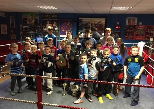 Kurt Walker with some of the younger members of Canal Boxing Academy. Kurt is a big inspiration to the young boxers.