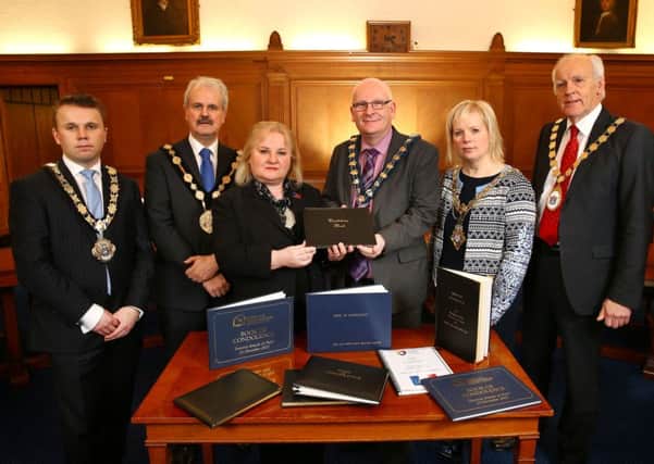 Mayor of Mid and East Antrim Councillor Billy Ashe (fourth from left) who has joined forces with other civic leaders to hand-over Books of Condolence for the victims of the terrorist attacks in Paris last November.
The  French Honorary Consul, Regine McCullough (third from left) received the Books. (Submited Picture).