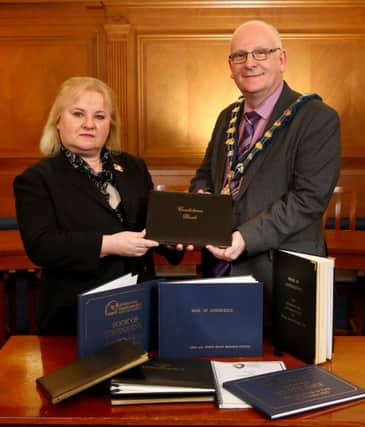 The French Honorary Consul, Regine McCullough receives  Books of Condolence from the Mayor of Mid and East Antrim Borough Council, Councillor Billy Ashe.  INCT 03-791-CON
