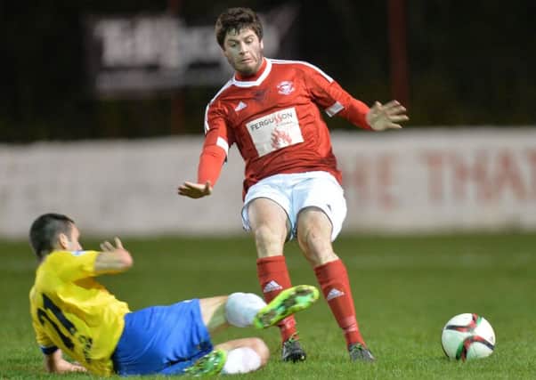 Michael Smith, pictured here in action for Larne against Ballymena United in the recent County Antrim Shield semi-final, has rejoined the Sky Blues for a second spell. Picture: Pacemaker Press.