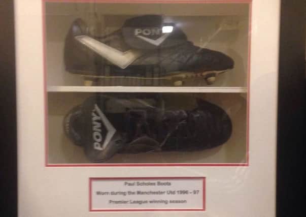 Paul Scholes has donated a pair of his boots from Manchester United's 1996/97 Premier League title-winning season to next month's charity event.
