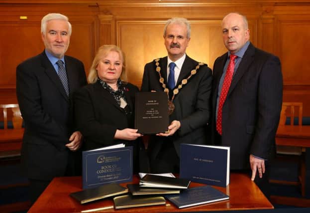 Presenting Books of Condolence for the Paris Attacks to the French Honorary Consul, Regine McCullough are (l-r)  Director of Corporate Services, Mr Adrian Donaldson, Councillor Thomas Beckett, Mayor of Lisburn & Castlereagh City Council, and Alderman James Tinsley, Chairman of the Corporate Services Committee.