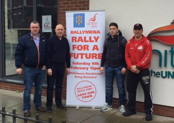 Mixed Martial Arts hero, Norman Parke took time out from training to endorse the Ballyjmena Rally for a Future. He is pictured outside the Unite offices in Ballymena with trainer, Rodney Moore and union officials. (Picture submitted)