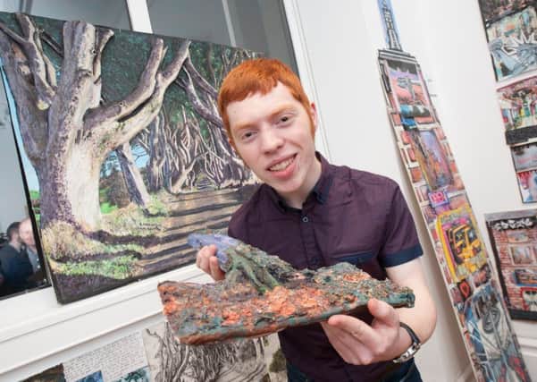 Cambridge House Grammar School pupil, Robert Millar shows off his piece of artwork which was part of the CCEAs True Colours exhibition at The Ulster Museum.