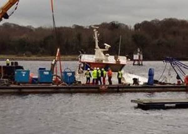 The scene at the pontoon as the boat is lifted. Photo: Danny Payne