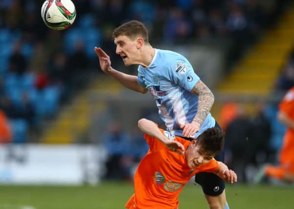 Ballymena United's Paddy McNally wins a header against Linfield's Paul Smyth  during Saturdays Danske Bank Premiership game at the Showgrounds. Picture: Press Eye.