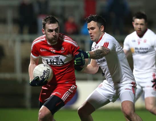 Ryan Bell takes on Cathal McCarron of Tyrone
. Picture by Andrew Paton/Press Eye.com