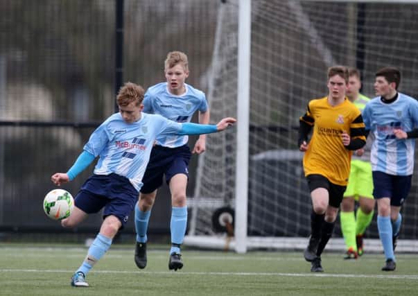 Andrew Smyth clears the ball upfield for Ballymena United under-16s in their match against Limavady. INBT 04-194CS
