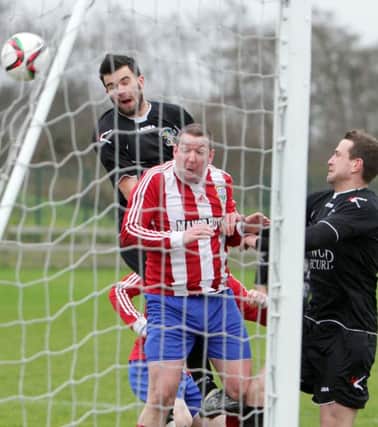 PRESSURE. Goalmouth action from Glebe's Intermediate Cup tie with Knockbreda on Sat.INBM4-16 027SC.