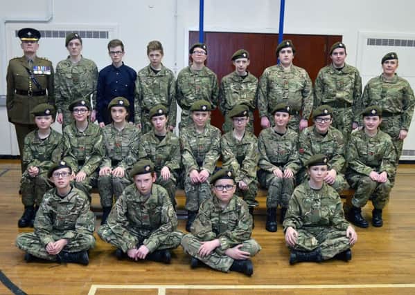 Cullybackey  Army Cadets pictured with officers last week in Cullybackey College hall where they attended their annual inspection evening for parents and friends. Photography by Hugo@Digital Image Photography