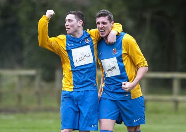 Nortel's Adam Irwin (left) congratulates team-mate Mark Wilkinson after scoring his second against Banbridge Town. INLT 04-911-CON Photo: Philip McCloy